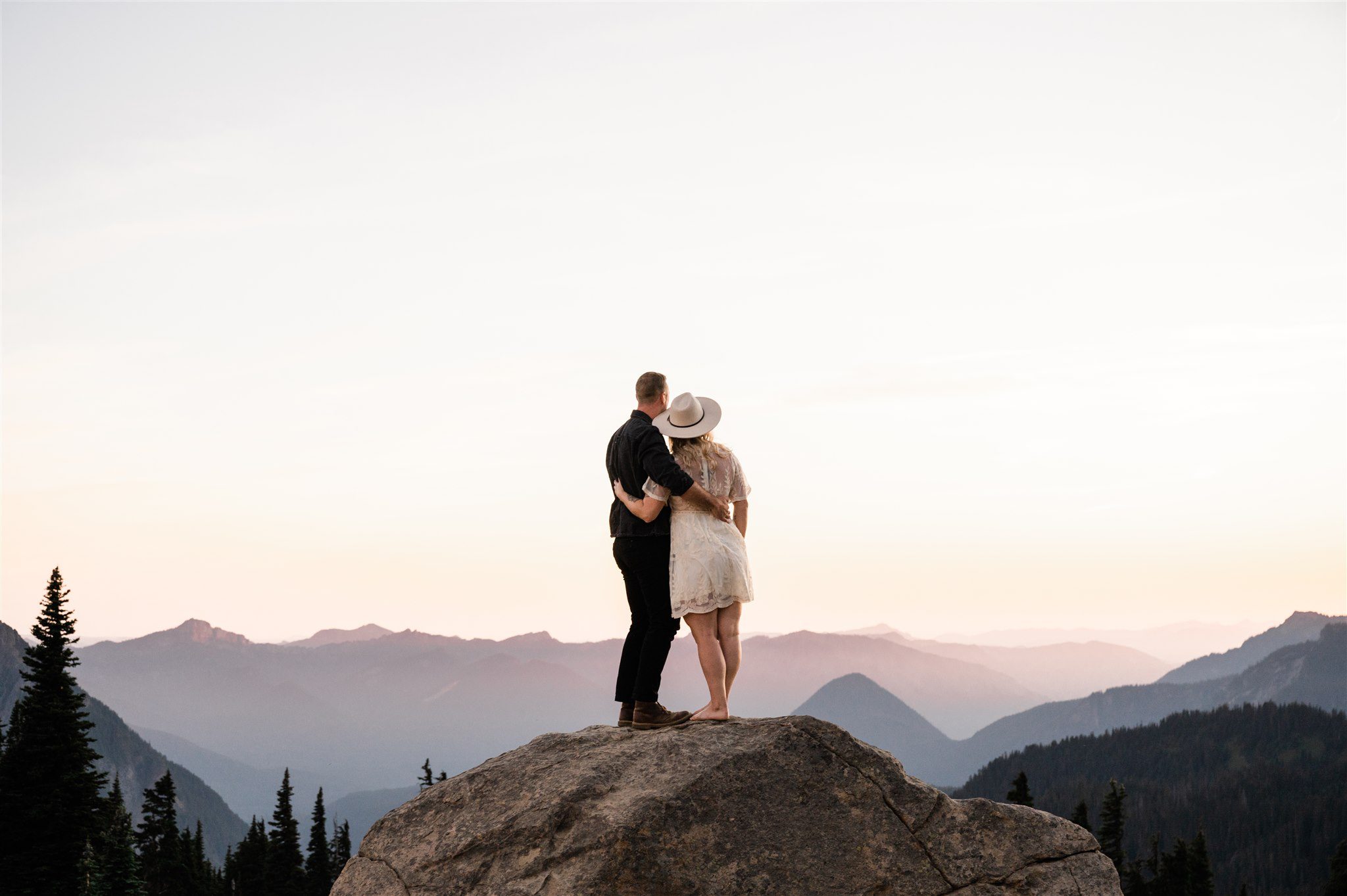 Couple hugging at sunset