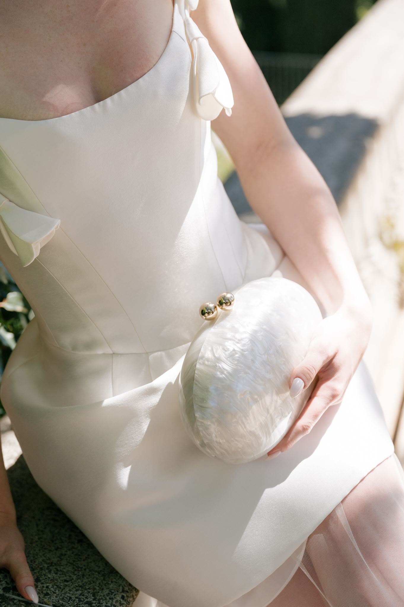 Wedding dress and clutch close up at Palais de Leon