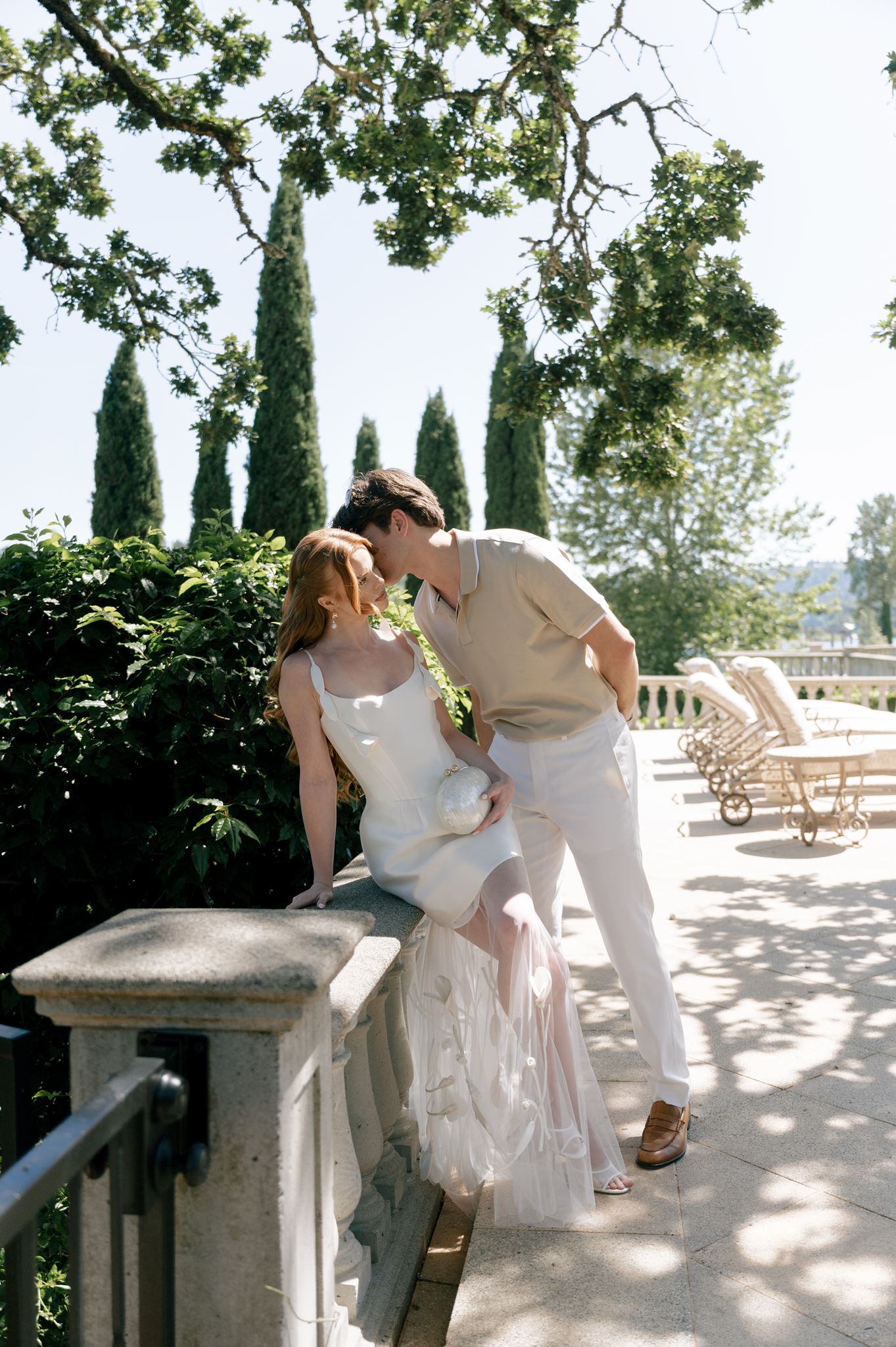 Couples wedding portraits next to the pool at Palais de Leon