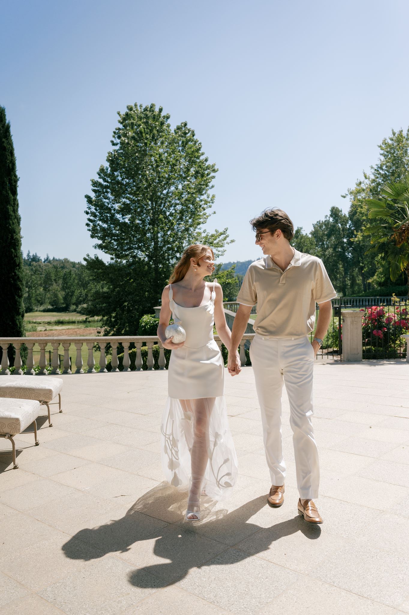 Couples wedding portraits next to the pool at Palais de Leon