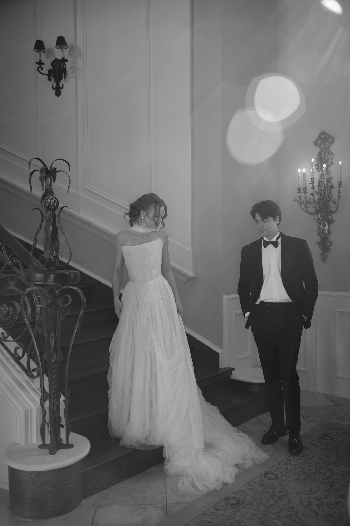 Wedding portraits on the grand staircase at the Palais de Leon wedding venue