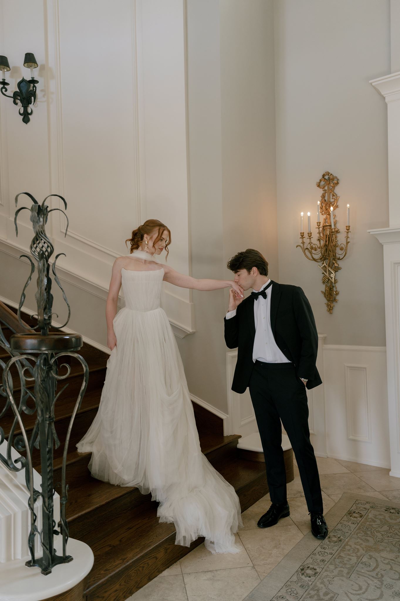 Wedding portraits on the grand staircase at the Palais de Leon wedding venue