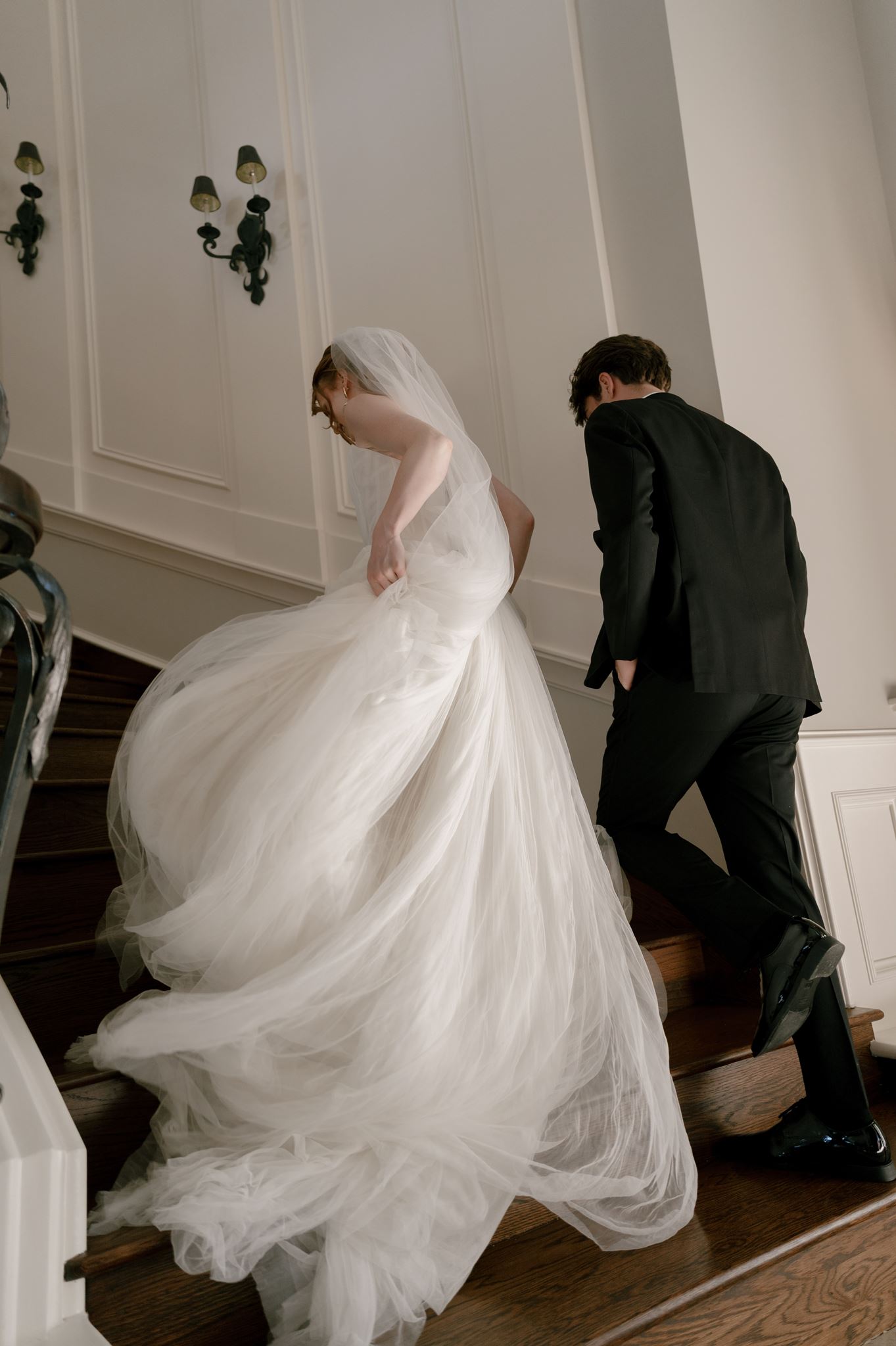 Wedding portraits on the grand staircase at the Palais de Leon wedding venue