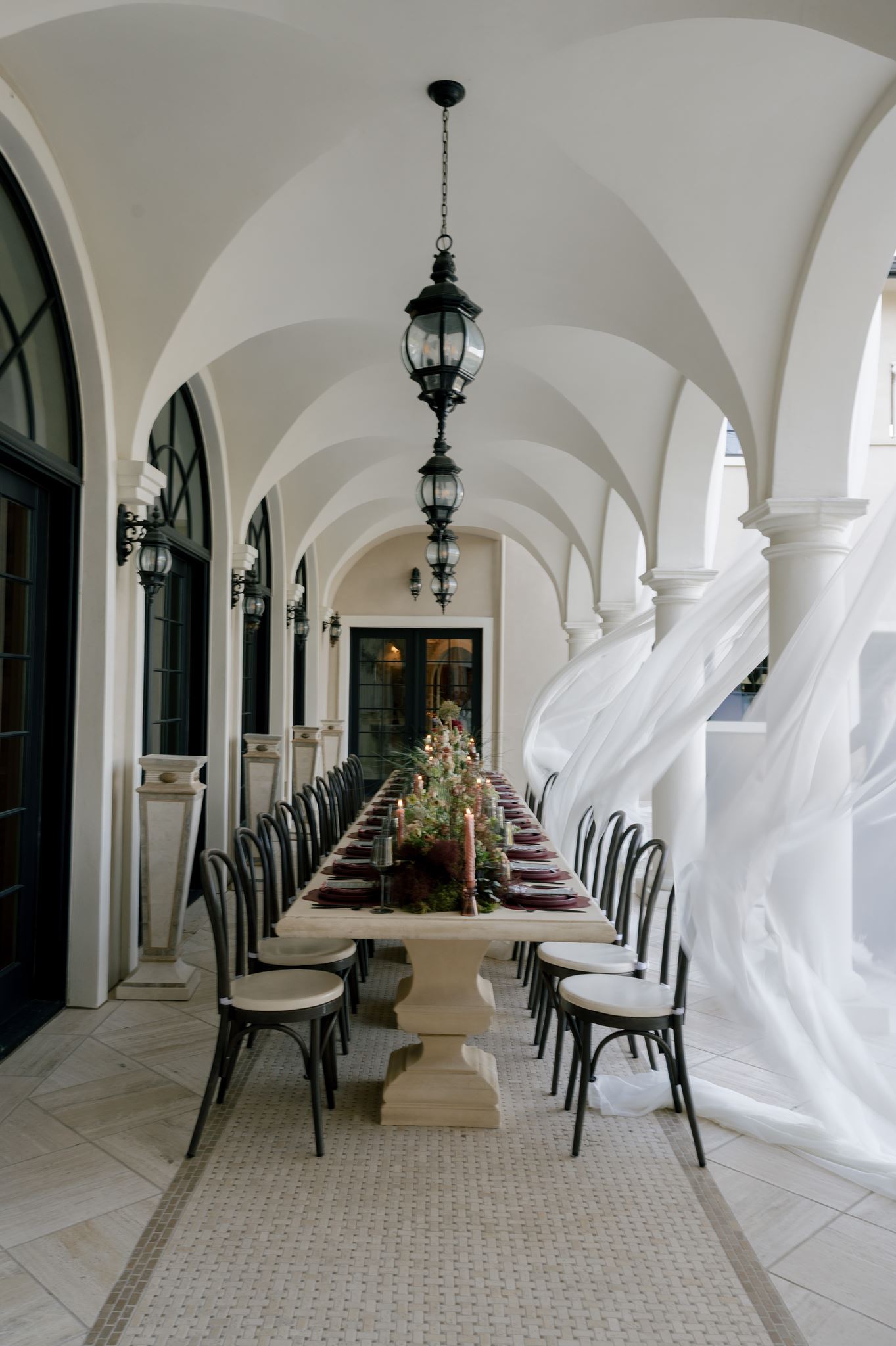 Outdoor wedding reception on the terrace at Palais de Leon
