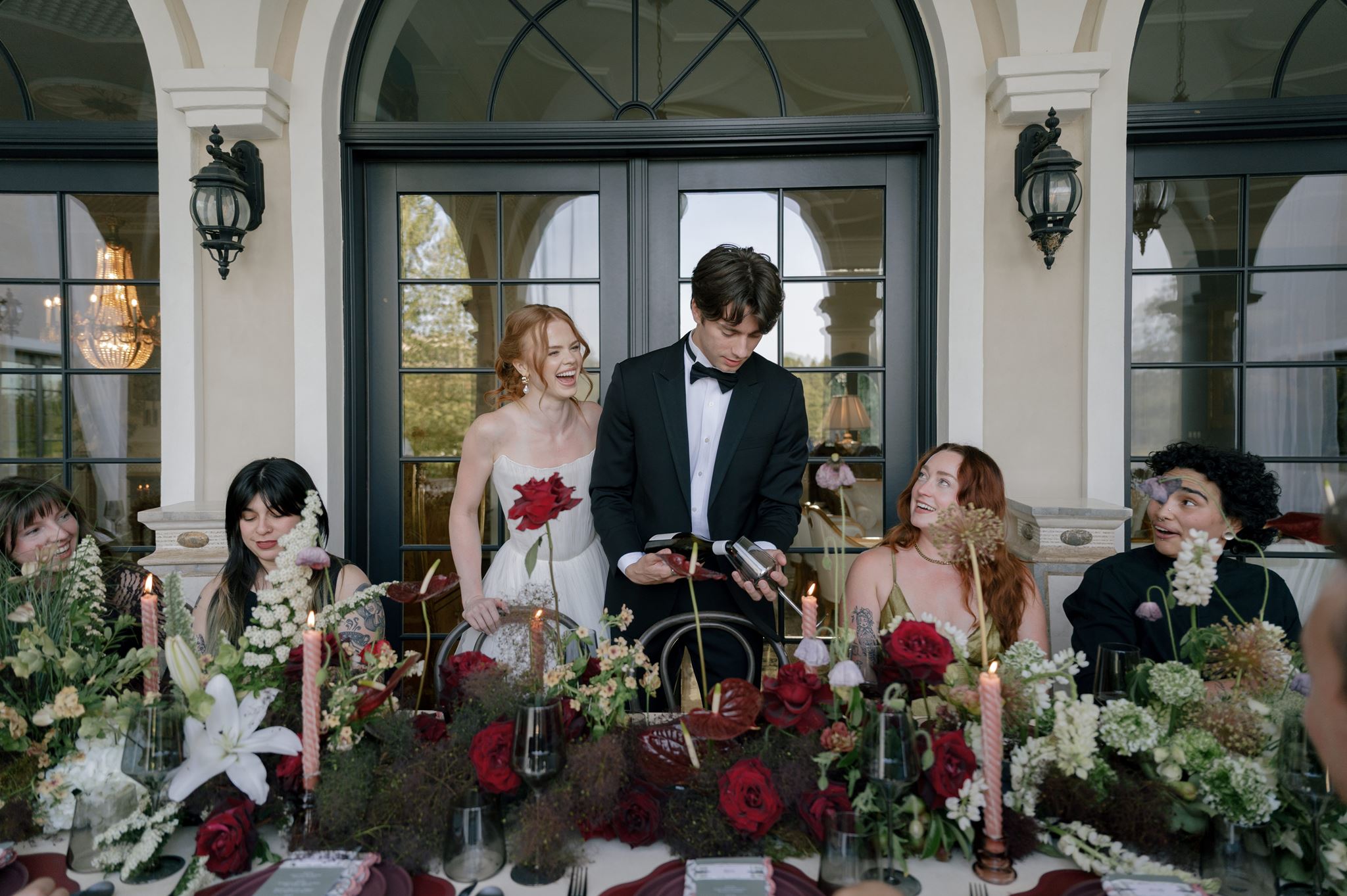 Bride and groom toast at wedding reception at Palais de Leon