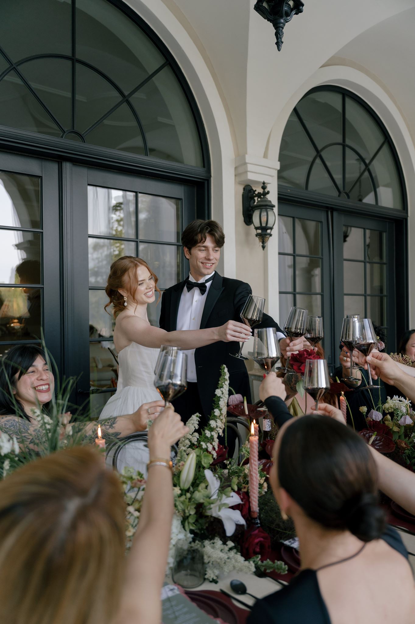 Bride and groom toasting at their wedding reception at Palais de Leon