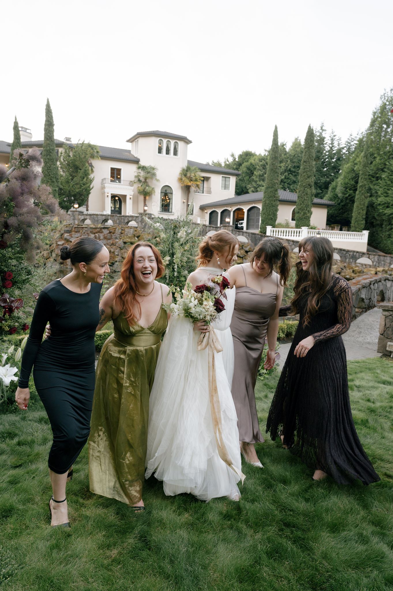 Bride and bridesmaids after the wedding ceremony at Palais de Leon