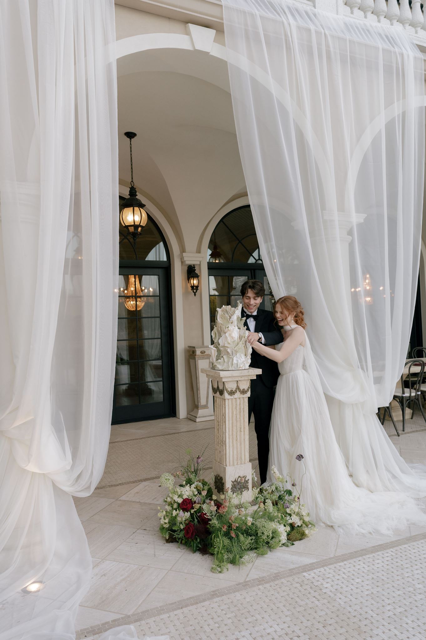Bride and groom cutting their wedding cake