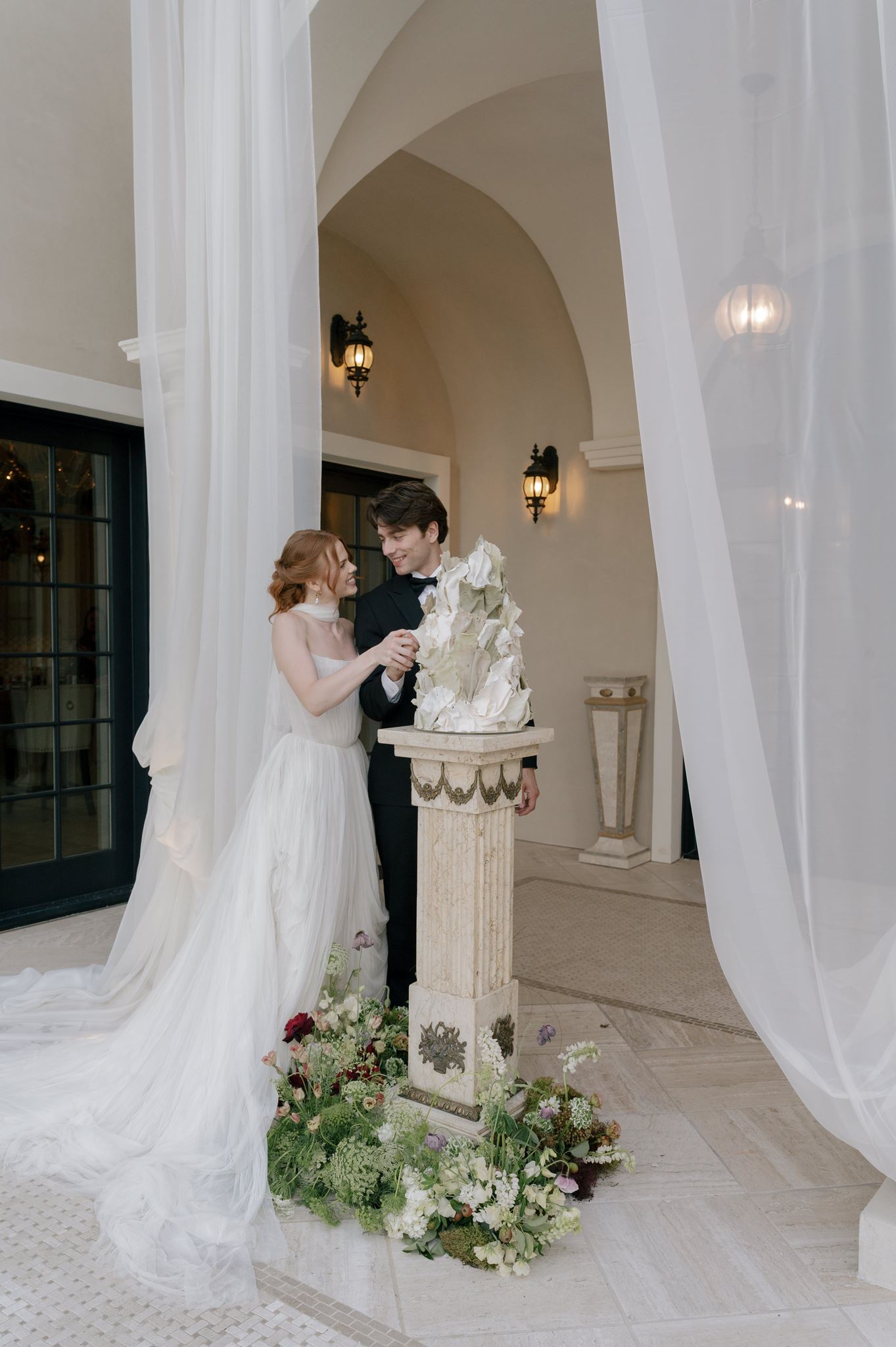 Bride and groom cutting their wedding cake